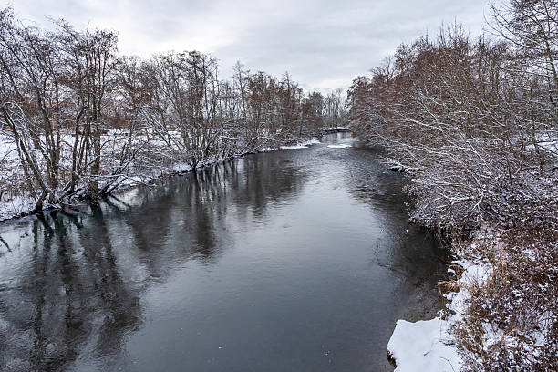 Snow covered small river in winter. Location is Shelton Ditch in Salem, Oregon