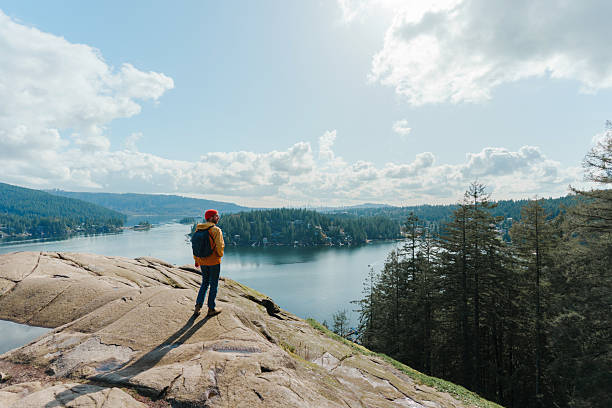 istock Man enjoying scenic view from Quarry Rock in Vancouver, Canada 2234510331