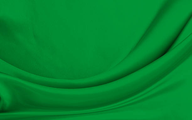 istock Black green satin dark fabric texture luxurious shiny that is abstract silk cloth background with patterns soft waves blur beautiful. 2234514887