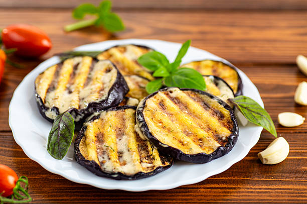 istock Appetizing eggplants with a golden crust and aromatic basil 2234520612