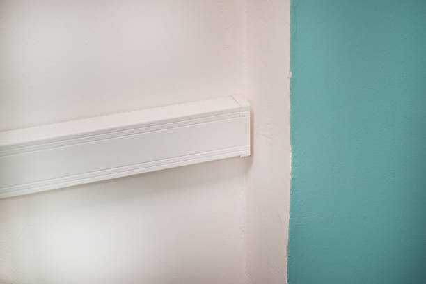 istock The electrical wire is on the wall in a plastic box. Decorative wire box. The cable channel. 2234523357
