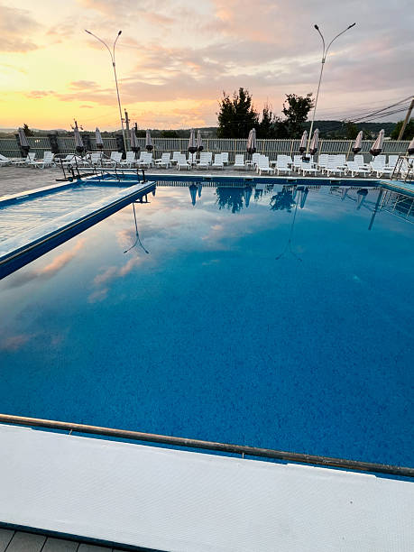 istock Outdoor pool with tranquil water and sunset reflection on a warm evening 2234523452