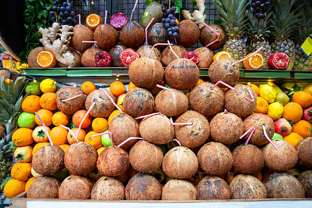 Variety of tropic fruits on street stand, ready for fresh juice