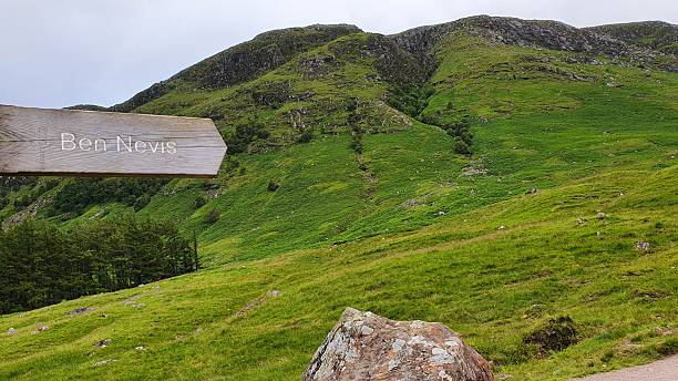 istock Ben Nevis Mountain Landscape with wooden sign 2234532048