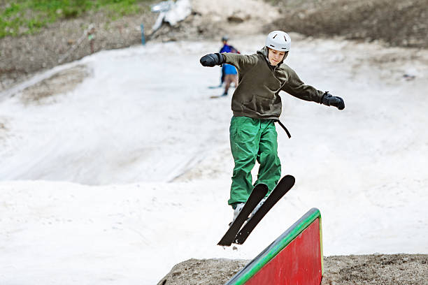 istock Boy practicing ski jibbing in summer snow park 2234538291