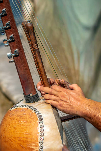 istock Musician Playing the Kora, Traditional West African String Instrument 2234538298