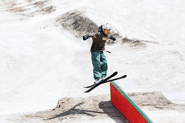 istock Boy practicing ski jibbing in summer snow park 2234538308