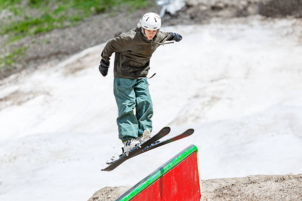 istock Boy practicing ski jibbing in summer snow park 2234538859