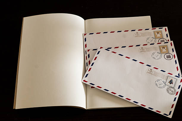 A blank notebook and envelopes for Lapland on a black background