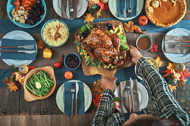 istock Stuffed Turkey for Thanksgiving Holidays with Mashed Potatoes, Green Beans, Vegetables and Pumpkin Pie 2234545410