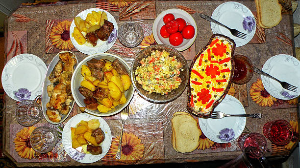 A beautifully set dinner table with an array of traditional homemade dishes for a family meal