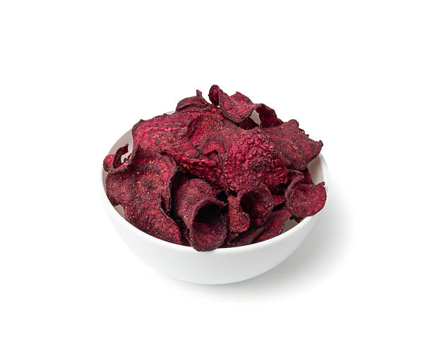 istock Dry beetroot chips isolated, dried sliced red beet flakes pile, beet root pieces and chips 2234547585
