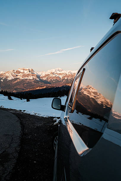 istock Reflection of snowcapped mountains in car mirror 2234550931