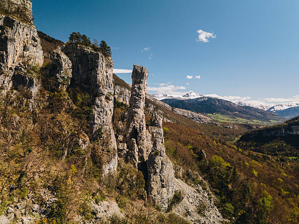 Hoodoo rock formations and snowcapped mountains, Les Tours St. Jacques