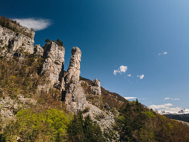 Hoodoo rock formations and snowcapped mountains, Les Tours St. Jacques