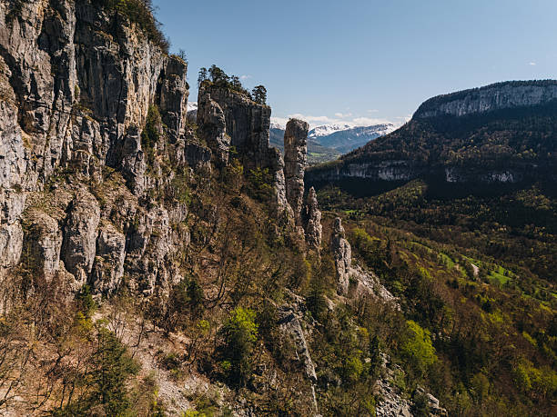 Hoodoo rock formations and snowcapped mountains, Les Tours St. Jacques