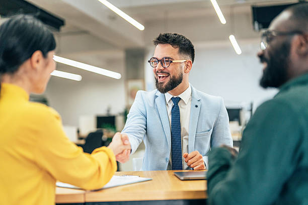 istock Meeting success. Business partners shaking hands 2234552606