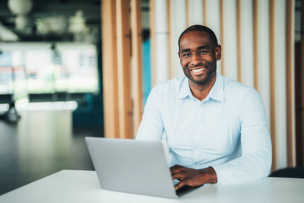 istock Confident business advisor sitting at desk in modern office 2234552630