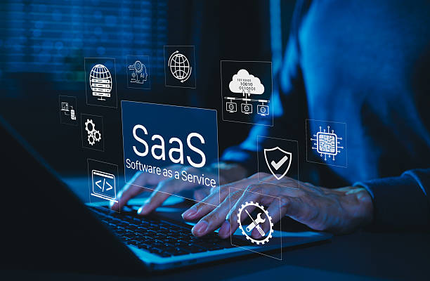 istock SaaS Software as a Service Digital Cloud Technology. Hands typing on laptop with SaaS icons representing cloud computing, data storage, software integration, security, and service based applications. 2234553600