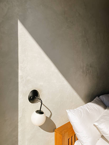 istock Classic sconce of round shape on the concrete wall 2234555676