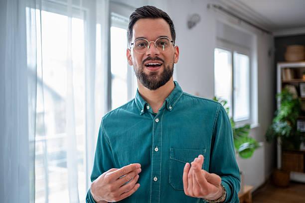 istock Young businessman having a video call from home office explaining something 2234556725