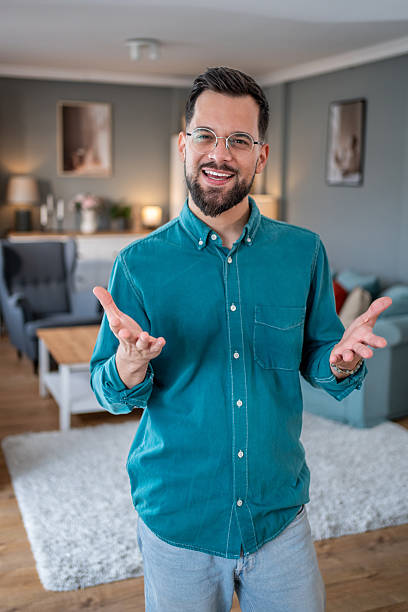 istock Young man having a video call from his living room 2234556886