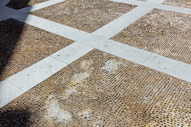 Traditional patterned pebble stone pavement texture in Cadiz, Andalusia, Spain, September 2025. High quality photo