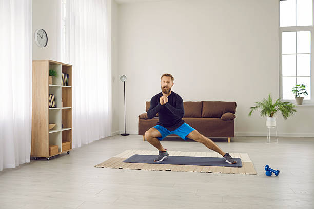 istock Motivated man do sports train at home 2234559664