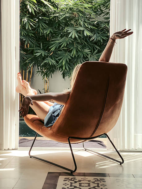 istock Woman sunbathing in a chair 2234565418