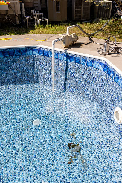 istock Pump removing water from swimming pool 2234565800