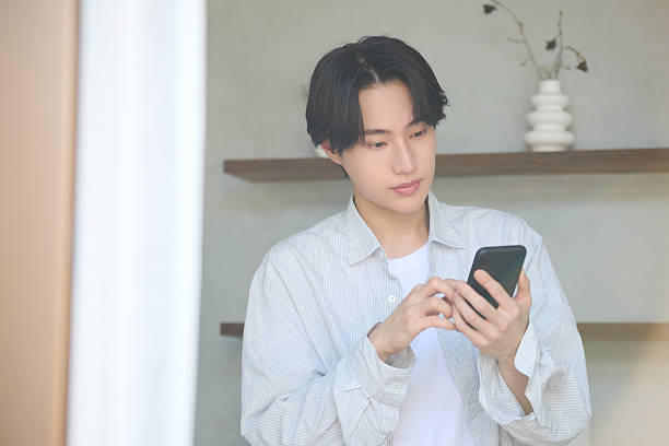 istock Young Asian man working from home 2234583541