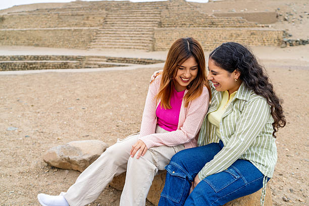 istock Tourists laughing together while exploring pre-inca ruins in desert 2234584840