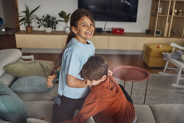 istock Beautiful siblings playing indoors 2234597520