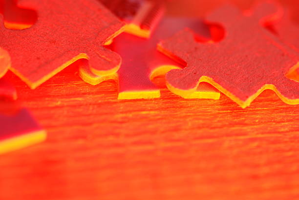 close up of red puzzle pieces