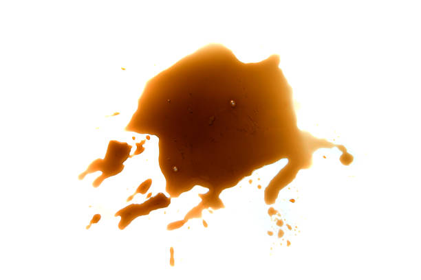 Spilled espresso coffee, stains isolated on white background, top view
