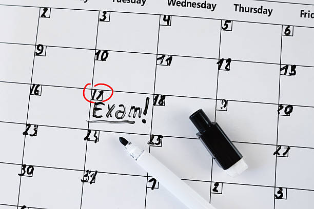 istock planner calendar with text inscription exam, education concept. 2234604826