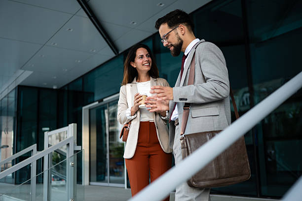 istock Business partners discussing during coffee break outside office building 2234606367