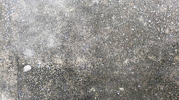 istock Gray cement floor with visible gravel stone texture background for construction and design 2234607018