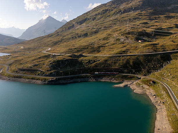 istock Mountain Lake with Green Hills and Clouds 2234608240