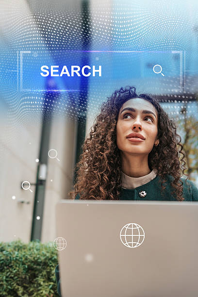 istock Woman using laptop in outdoor space for search tasks during a sunny day 2234609426