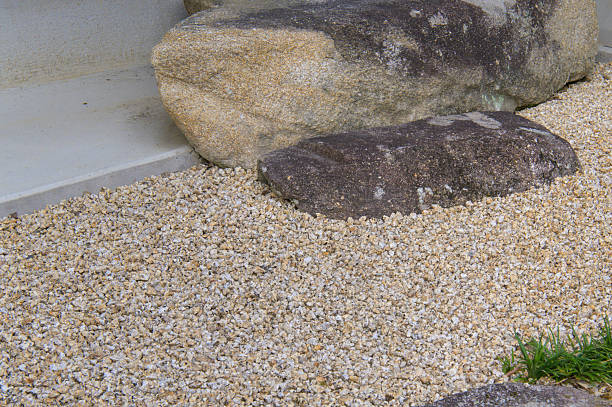 istock Shoe-removing stone surrounded by gravel 2234609501