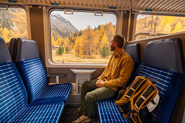 istock Man Enjoying Autumn Train Ride View 2234609798