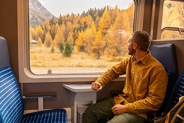 istock Man on a beautiful train journey in Autumn 2234610035