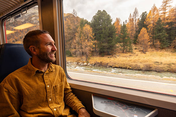 istock Man on a beautiful train journey in Autumn 2234610196