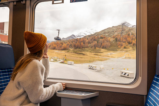 istock Woman Enjoying Scenic Mountain Train Ride 2234610382