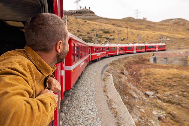 istock Man on a beautiful train journey in Autumn 2234611041