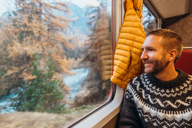 istock Man on a beautiful train journey in Autumn 2234611602
