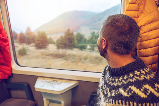 istock Man on a beautiful train journey in Autumn 2234611727