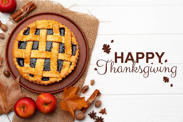 istock Thanksgiving dessert display featuring a lattice pie surrounded by autumn decorations 2234612837