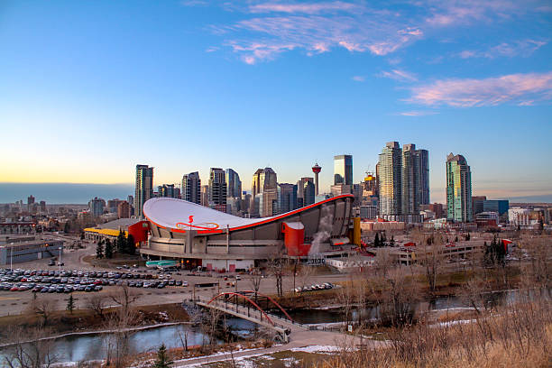 Calgary, Canada - November 2017: The ever-changing skyline of Canada's oil capital, Calgary. Calgary is also known for hosting world's largest rodeo festival in the world (the Calgary Stampede), and hosting the 1988 Winter Olympics. The arena has been part of Calgary's skyline since 1983, but it's set for demolition in 2027, as it's replacement is being built right now.